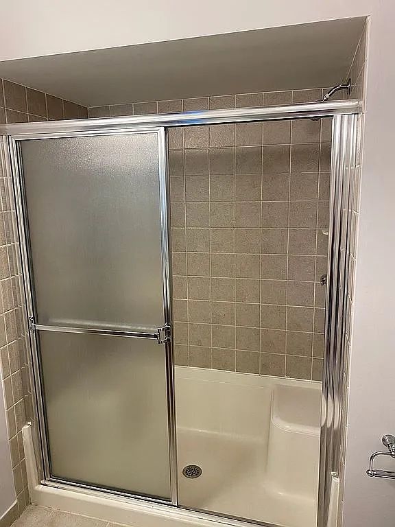 18203 Adri Cir, Walled Lake, MI 48390 - full bathroom featuring a shower stall