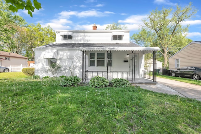 view of front of property featuring covered porch and a chimney