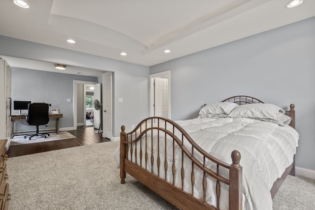 carpeted bedroom featuring recessed lighting, baseboards, an office area, vaulted ceiling, and wood finished floors