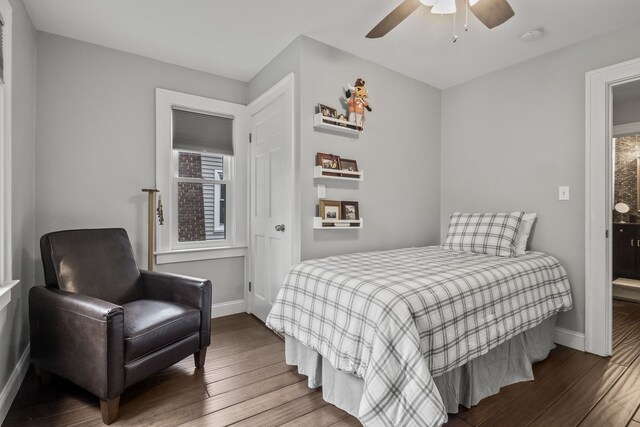 bedroom with wood finished floors, baseboards, and a ceiling fan