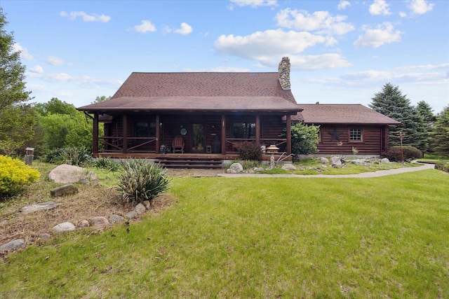 5114 N Oak Rd, Davison, MI 48423 - rear view of property with a yard, log exterior, a porch, and a chimney
