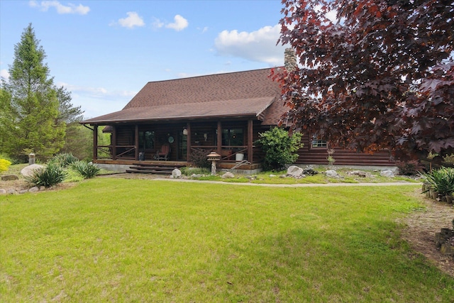 5114 N Oak Rd, Davison, MI 48423 - back of property featuring a lawn, log siding, a porch, and roof with shingles