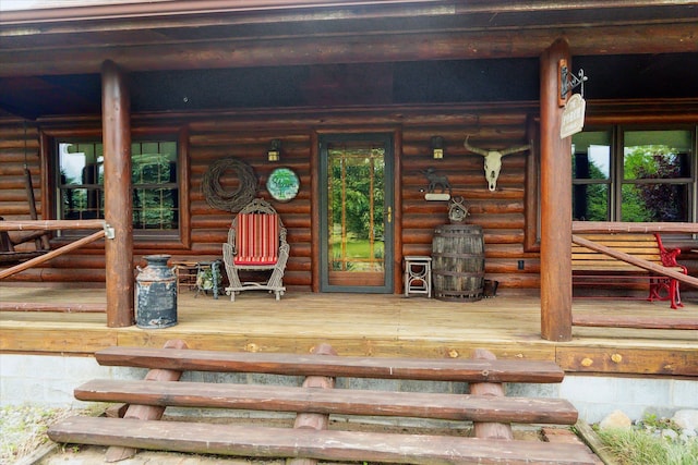 5114 N Oak Rd, Davison, MI 48423 - doorway to property with covered porch and log siding