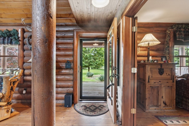 5114 N Oak Rd, Davison, MI 48423 - foyer entrance featuring wood-type flooring, rustic walls, and wooden ceiling