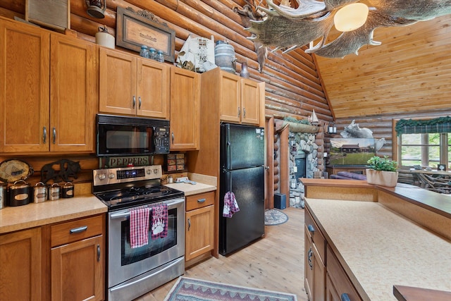 5114 N Oak Rd, Davison, MI 48423 - kitchen with black appliances, log walls, light wood finished floors, light countertops, and brown cabinets