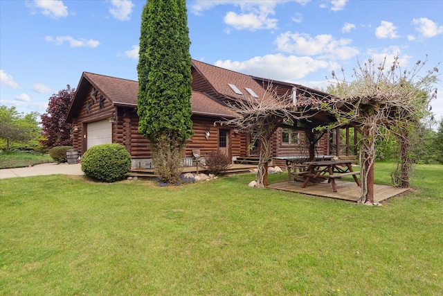 5114 N Oak Rd, Davison, MI 48423 - rear view of property featuring log exterior, an attached garage, a lawn, roof with shingles, and driveway