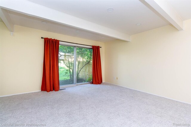 3531 Burbank Dr, Ann Arbor, MI 48105 - unfurnished room with beam ceiling, carpet flooring, and baseboards
