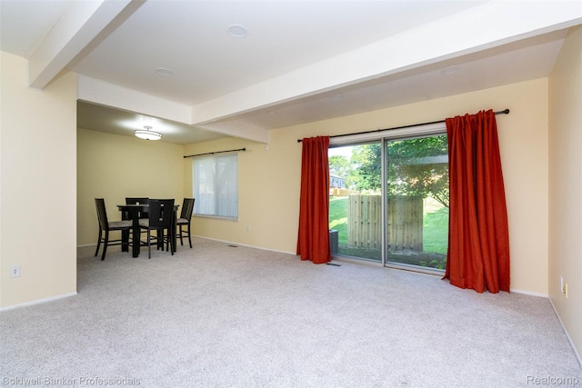 3531 Burbank Dr, Ann Arbor, MI 48105 - dining room with beamed ceiling, carpet, and baseboards