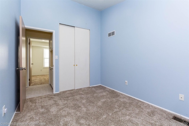 3531 Burbank Dr, Ann Arbor, MI 48105 - unfurnished bedroom with carpet floors, a closet, and baseboards