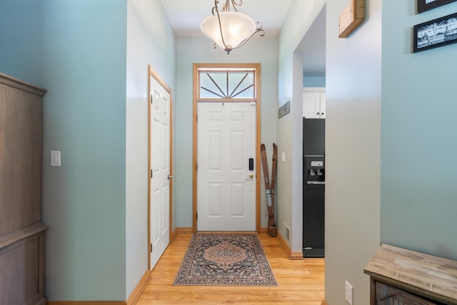 7918 Dan Patch Dr, Jackson, MI 49201 - foyer entrance with light wood-style flooring and baseboards
