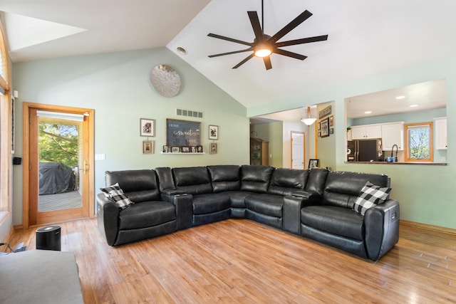 7918 Dan Patch Dr, Jackson, MI 49201 - living area with ceiling fan, light wood-style flooring, and high vaulted ceiling