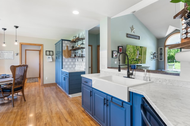 7918 Dan Patch Dr, Jackson, MI 49201 - kitchen with blue cabinetry, a sink, open shelves, dishwashing machine, and light wood-type flooring