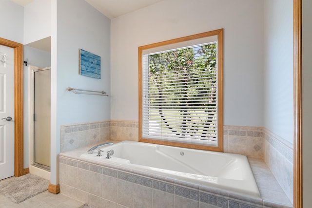 7918 Dan Patch Dr, Jackson, MI 49201 - bathroom with a shower stall, a garden tub, and tile patterned flooring