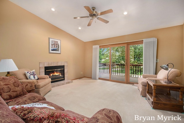 607 Crestview St, Holland, MI 49423 - living room with carpet, a ceiling fan, a fireplace, vaulted ceiling, and recessed lighting