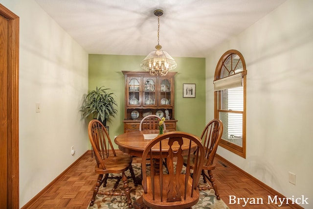 607 Crestview St, Holland, MI 49423 - dining space with a chandelier and baseboards