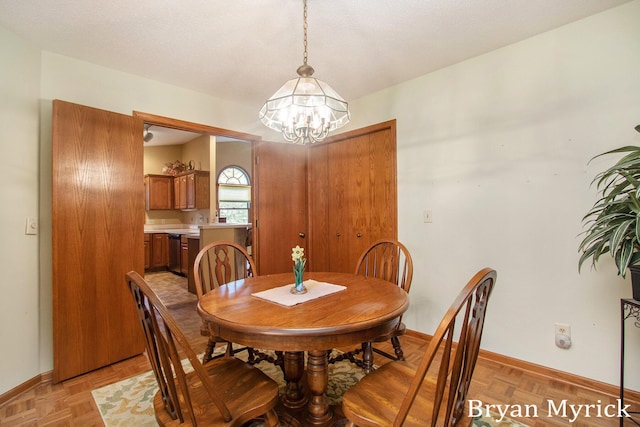 607 Crestview St, Holland, MI 49423 - dining space with a chandelier and baseboards