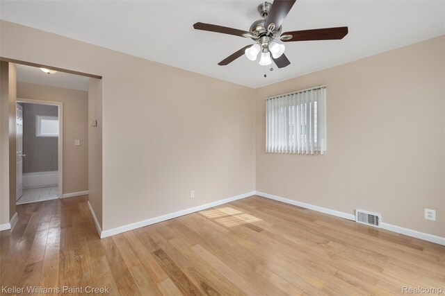 12777 Sherman Ave, Warren, MI 48089 - empty room with ceiling fan, plenty of natural light, light wood-style flooring, and baseboards