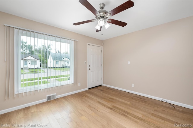 12777 Sherman Ave, Warren, MI 48089 - spare room featuring baseboards, light wood-style floors, and ceiling fan