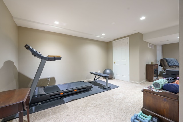 exercise area with light colored carpet, recessed lighting, and baseboards