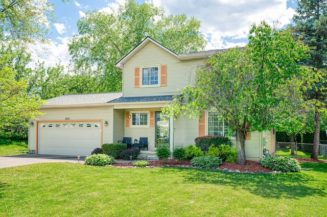traditional-style home with concrete driveway and a garage