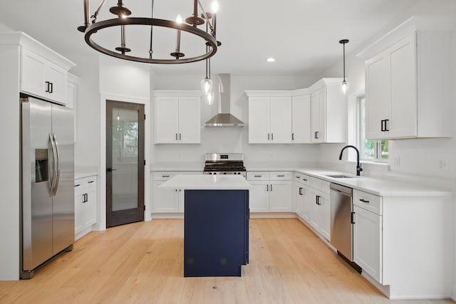 47309 Jefferson Ave, Chesterfield, MI 48047 - kitchen featuring appliances with stainless steel finishes, wall chimney range hood, a sink, a chandelier, and a center island