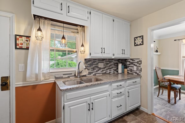 2369 Airport Rd, Adrian, MI 49221 - kitchen with a sink, backsplash, white cabinets, and light stone countertops