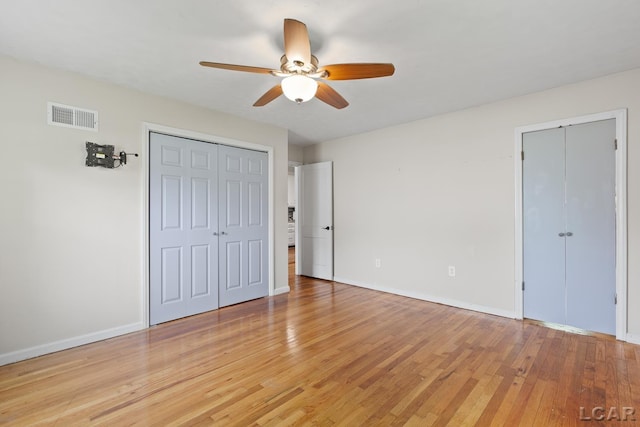 2369 Airport Rd, Adrian, MI 49221 - unfurnished bedroom with light wood-type flooring, baseboards, and a ceiling fan