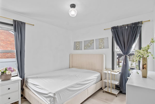 bedroom with light wood finished floors