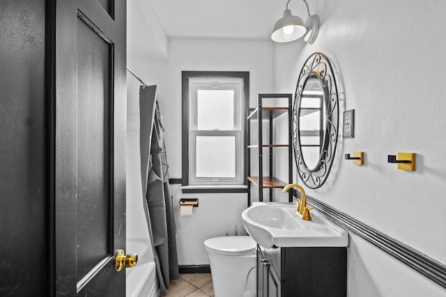 full bath featuring tile patterned floors, toilet, vanity, and shower / bathtub combination