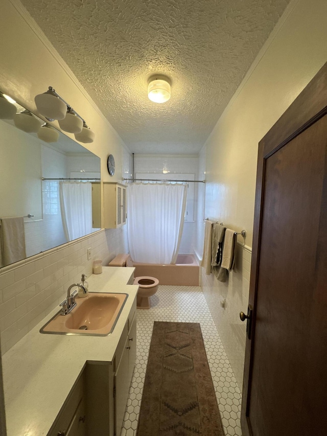 701 Chestnut St, Grayling, MI 49738 - full bath with vanity, shower / bath combination with curtain, toilet, a textured ceiling, and backsplash