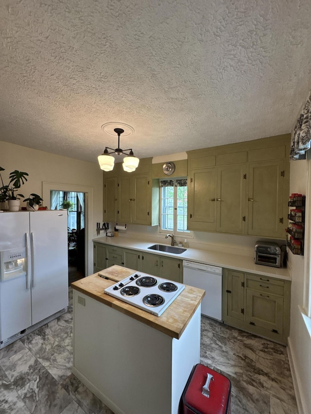 701 Chestnut St, Grayling, MI 49738 - kitchen featuring white appliances, a sink, butcher block countertops, a kitchen island, and light marble finish floors