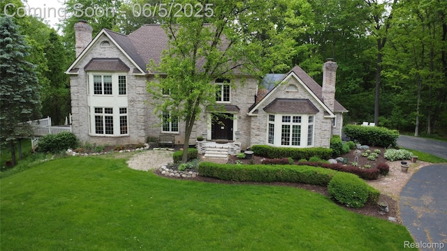4270 Argenta Dr, Brighton, MI 48116 - view of front of house with a chimney and a front lawn