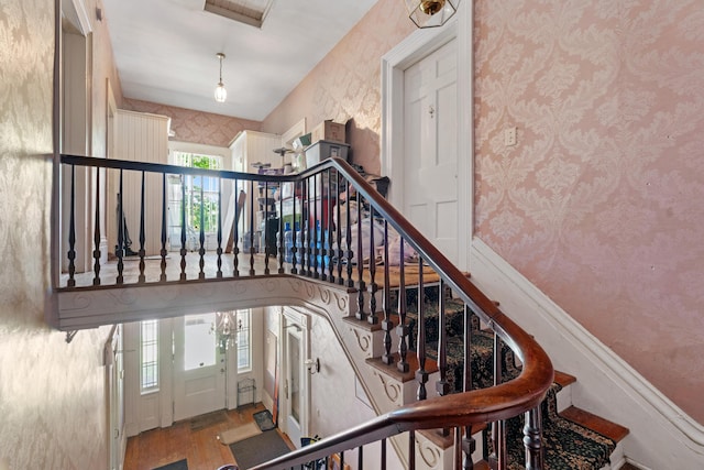 447 W Vine St, Kalamazoo, MI 49001 - stairway with wood finished floors and wallpapered walls