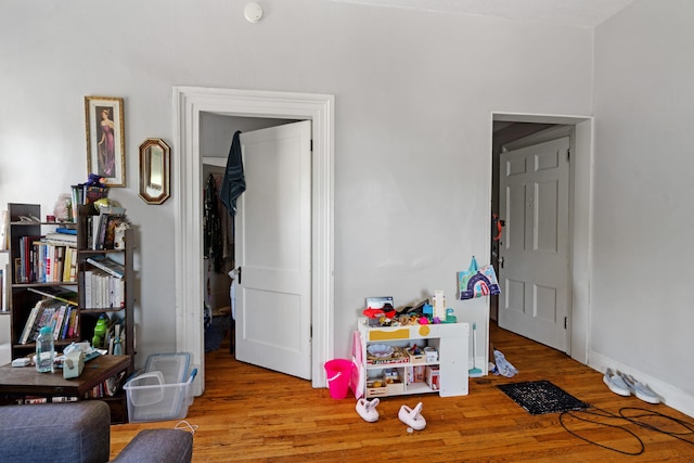447 W Vine St, Kalamazoo, MI 49001 - playroom featuring wood finished floors and baseboards