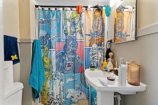 447 W Vine St, Kalamazoo, MI 49001 - bathroom with tile walls and toilet