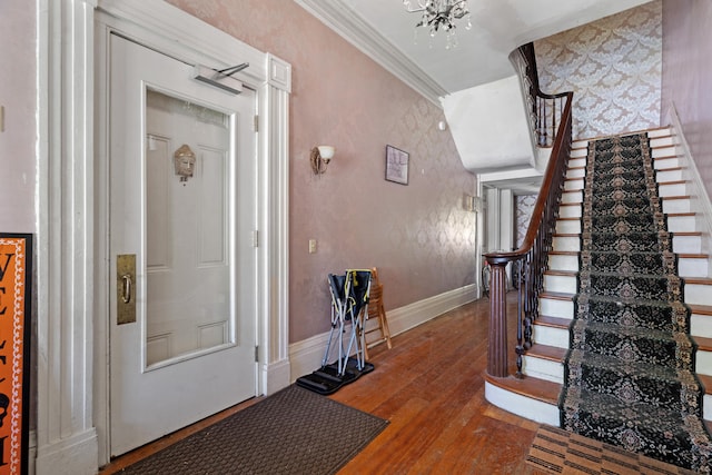 447 W Vine St, Kalamazoo, MI 49001 - entrance foyer featuring stairs, wood finished floors, ornamental molding, and baseboards