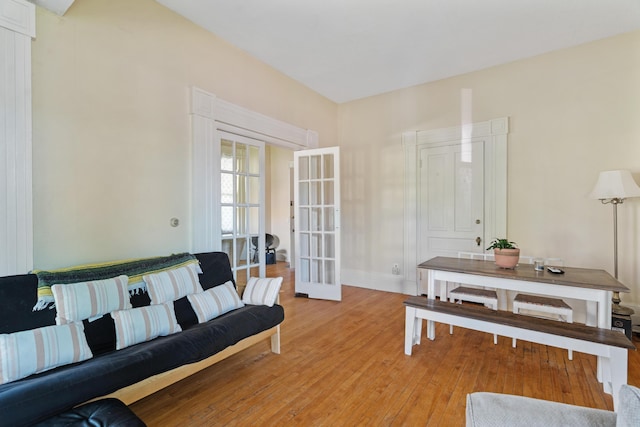447 W Vine St, Kalamazoo, MI 49001 - living area featuring french doors, light wood finished floors, and baseboards