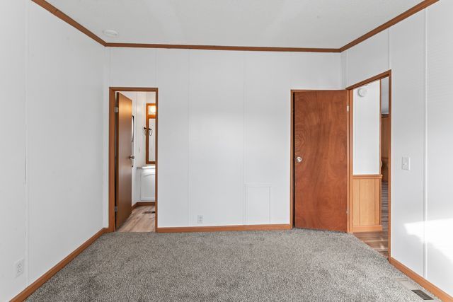 25 Hunters Rill, Lapeer, MI 48446 - carpeted empty room featuring ornamental molding