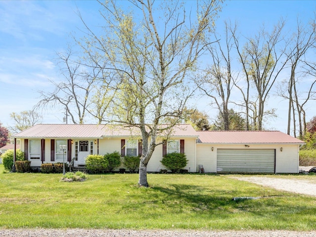 5943 Avalon Cir, Lexington, MI 48450 - ranch-style house with a garage, driveway, metal roof, and a front yard