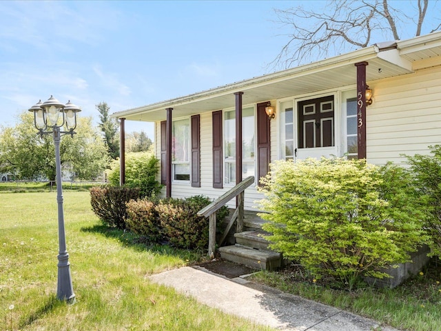 5943 Avalon Cir, Lexington, MI 48450 - entrance to property featuring a lawn and a porch