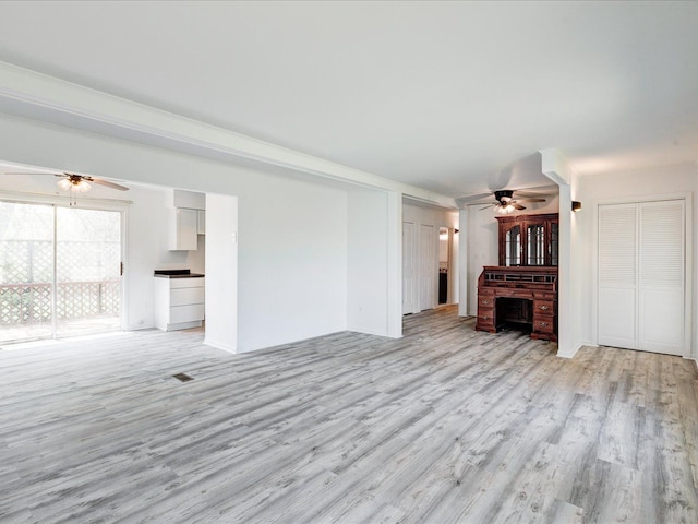 5943 Avalon Cir, Lexington, MI 48450 - unfurnished living room with ceiling fan and light wood-style floors
