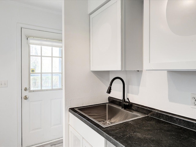 5943 Avalon Cir, Lexington, MI 48450 - kitchen with a sink, white cabinets, and dark countertops