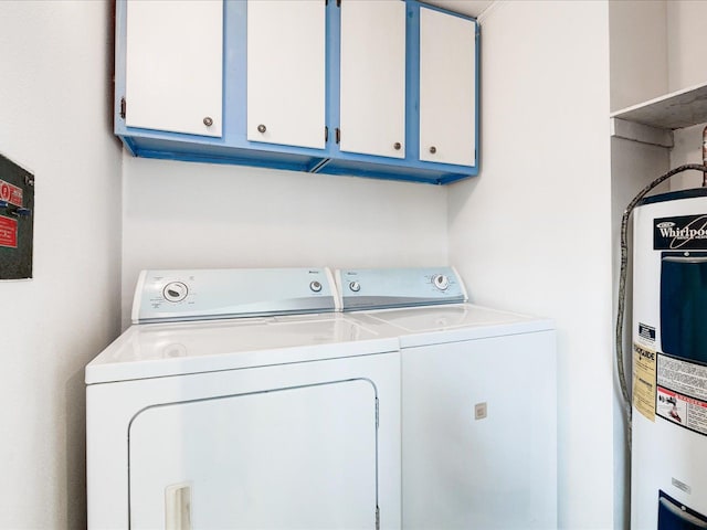 5943 Avalon Cir, Lexington, MI 48450 - washroom featuring washing machine and dryer, electric water heater, and cabinet space
