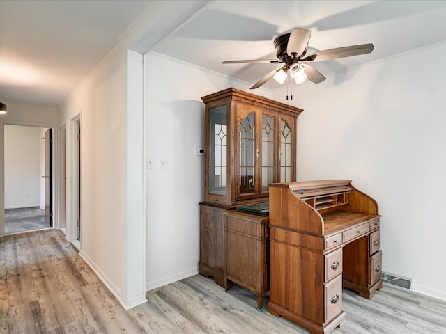 5943 Avalon Cir, Lexington, MI 48450 - home office with light wood-type flooring, a ceiling fan, ornamental molding, and baseboards