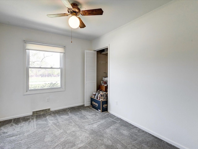 5943 Avalon Cir, Lexington, MI 48450 - spare room featuring a ceiling fan, carpet flooring, and baseboards
