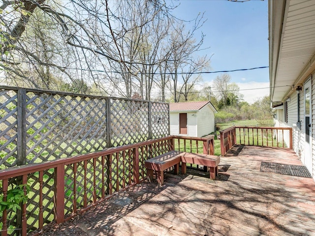 5943 Avalon Cir, Lexington, MI 48450 - wooden terrace featuring an outbuilding