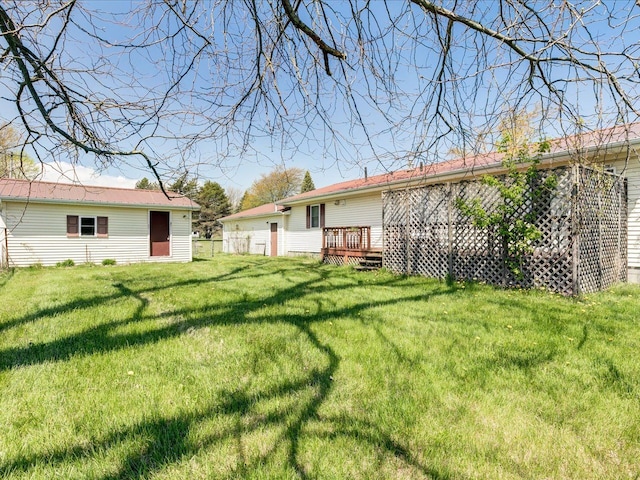 5943 Avalon Cir, Lexington, MI 48450 - view of green lawn with a wooden deck