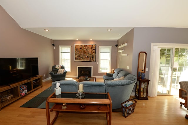 722 Bennington St, East Tawas, MI 48730 - living room with a fireplace, light wood-type flooring, plenty of natural light, and recessed lighting