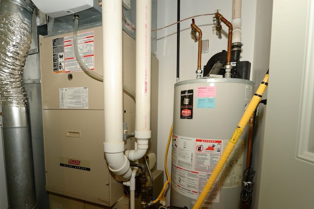 722 Bennington St, East Tawas, MI 48730 - utility room featuring water heater and heating unit