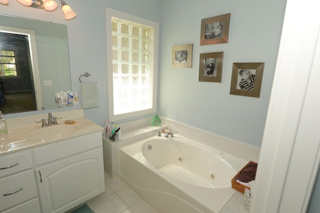 722 Bennington St, East Tawas, MI 48730 - bathroom with vanity, a jetted tub, and tile patterned flooring